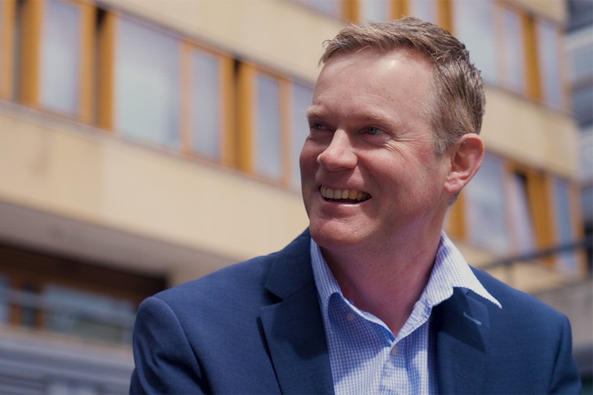 Man smiling wearing a suit