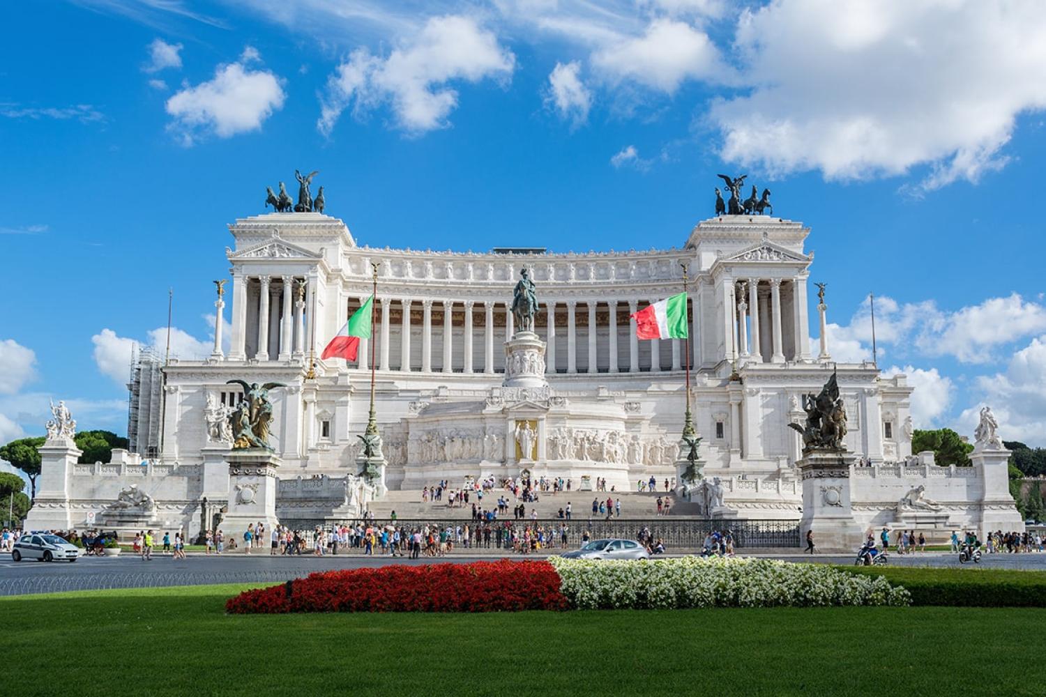 Victor Emmanuel II Monument in Rome with flowerbed in foreground