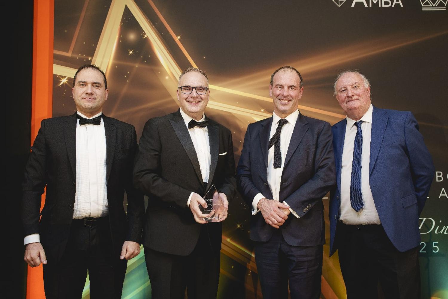 Professor Gavin Jack and James Close receiving the ‘Best Business School Partnership’ Excellence Award at the AMBA & BGA Excellence Awards 2025