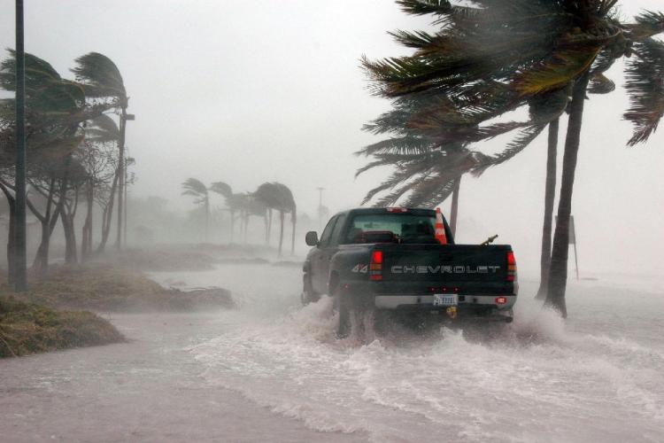 A pick-up truck driving through floodwater during a storm in Florida