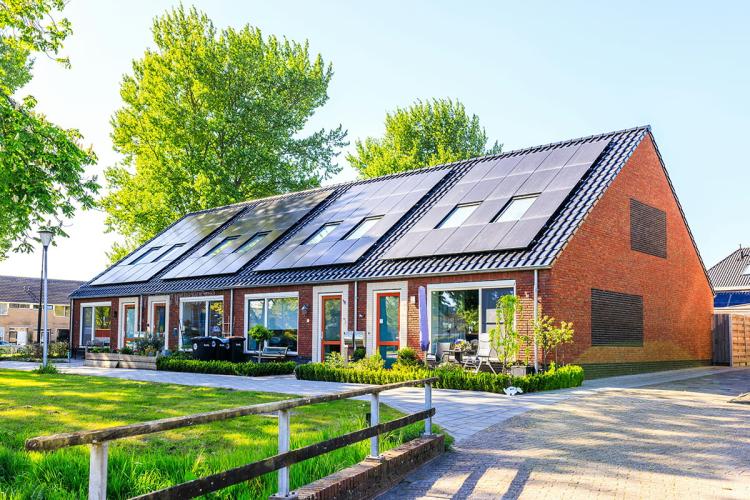 Small row of terraced homes in the Netherlands with solar panels on the roof